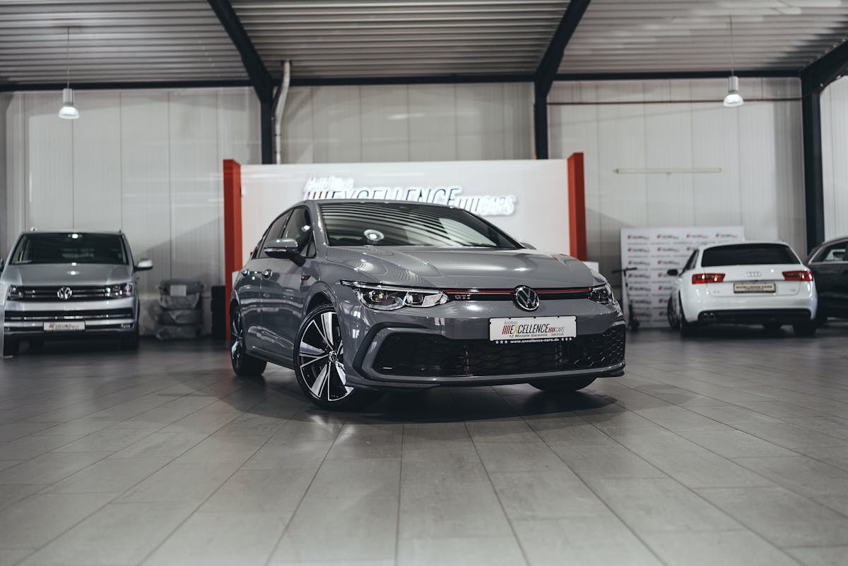 Modern car displayed inside a dealership showroom